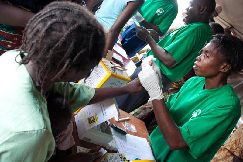 A woman is tested for malaria using an RDT. Photo: PATH/Gena Morgan